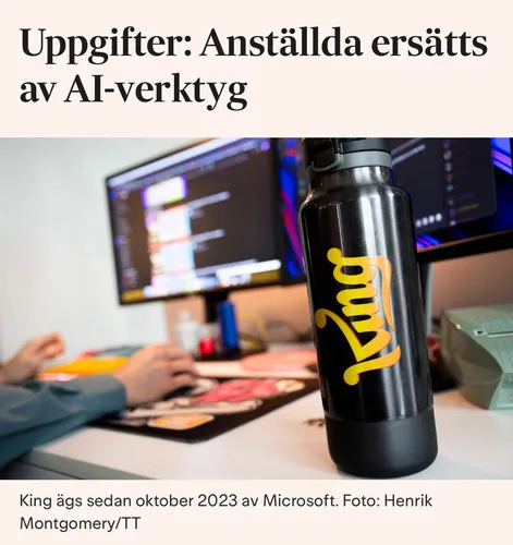 Rubriken "Uppgifter: Anställda ersätts av AI-verktyg", bild på skrivbord och vattenflaska med spelföretaget Kings logga tryckt.